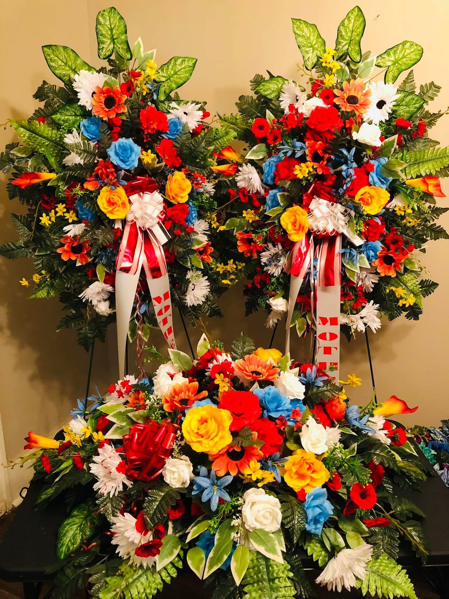 Floral Arrangements ( Include 2 Stand sprays and a Casket Spray)